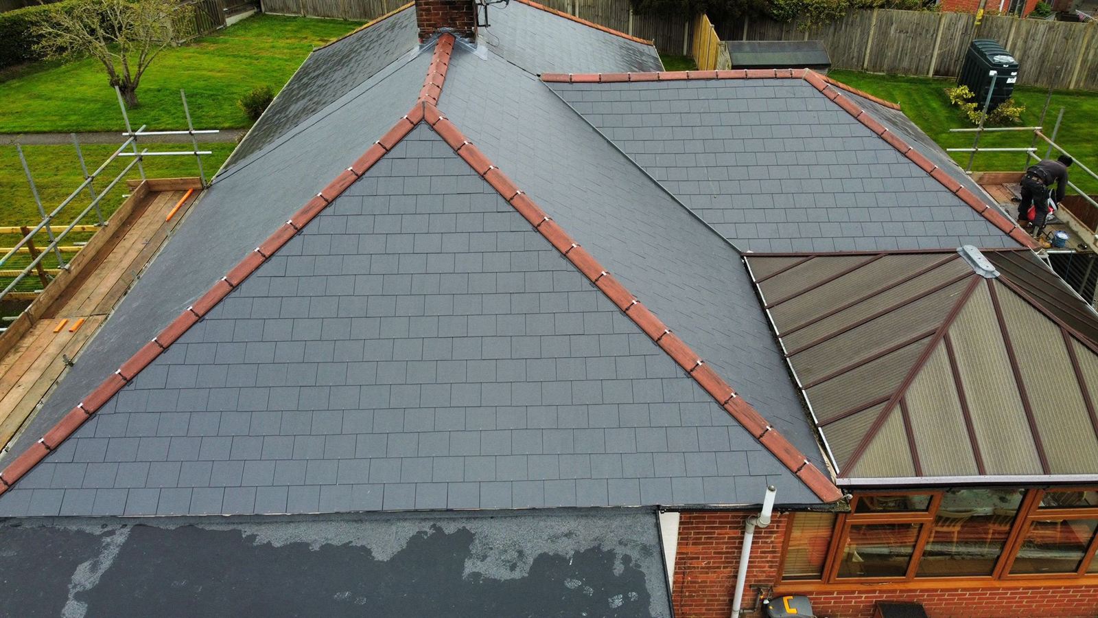 Completed slate roof with red ridge