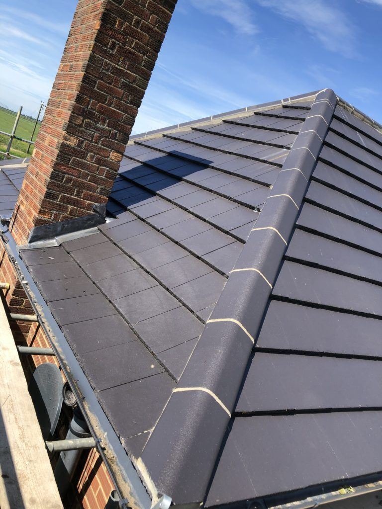 New slate effect roof with dry hip