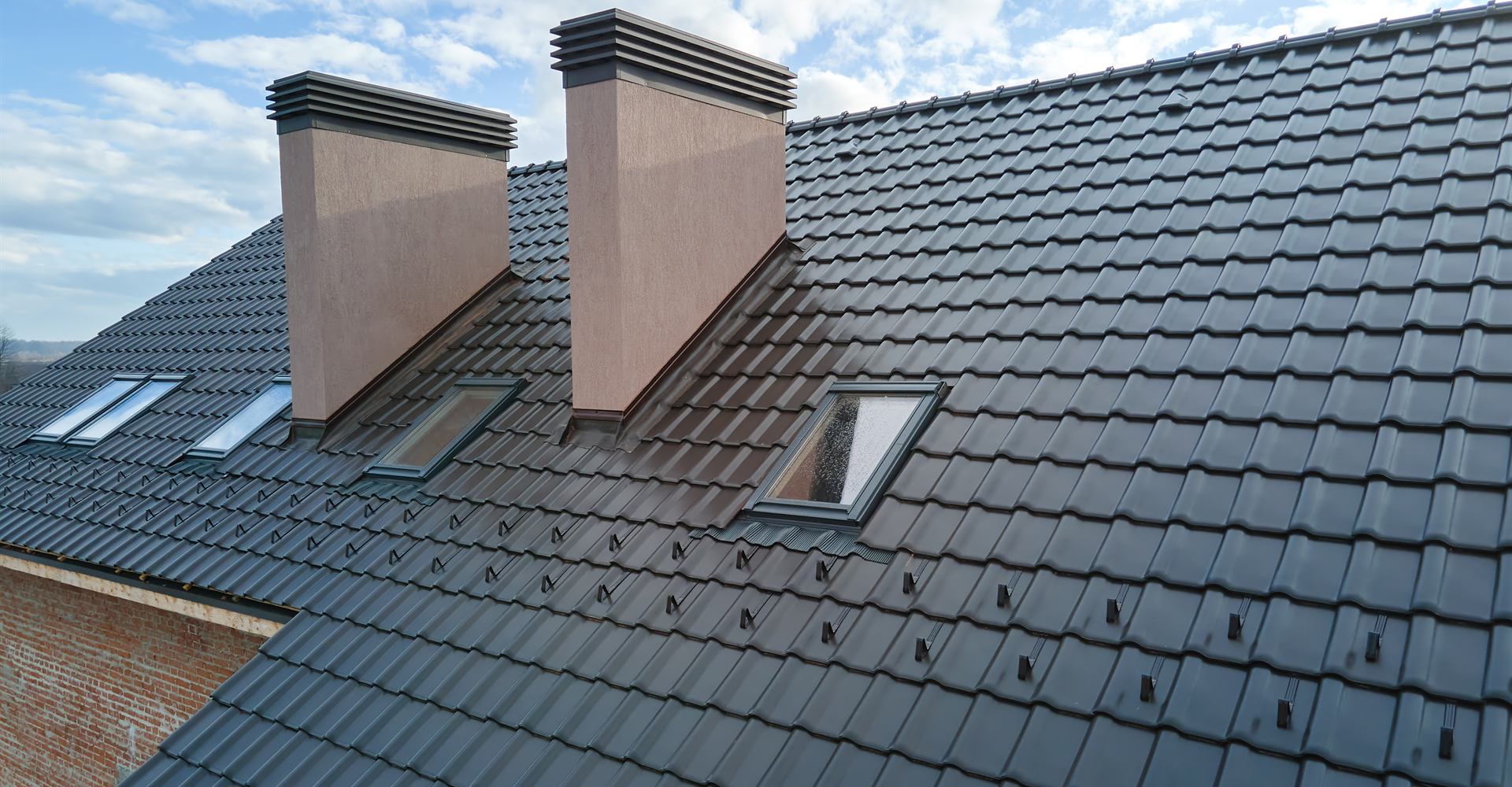 Newly tiled grey roof on a house in Northamptonshire