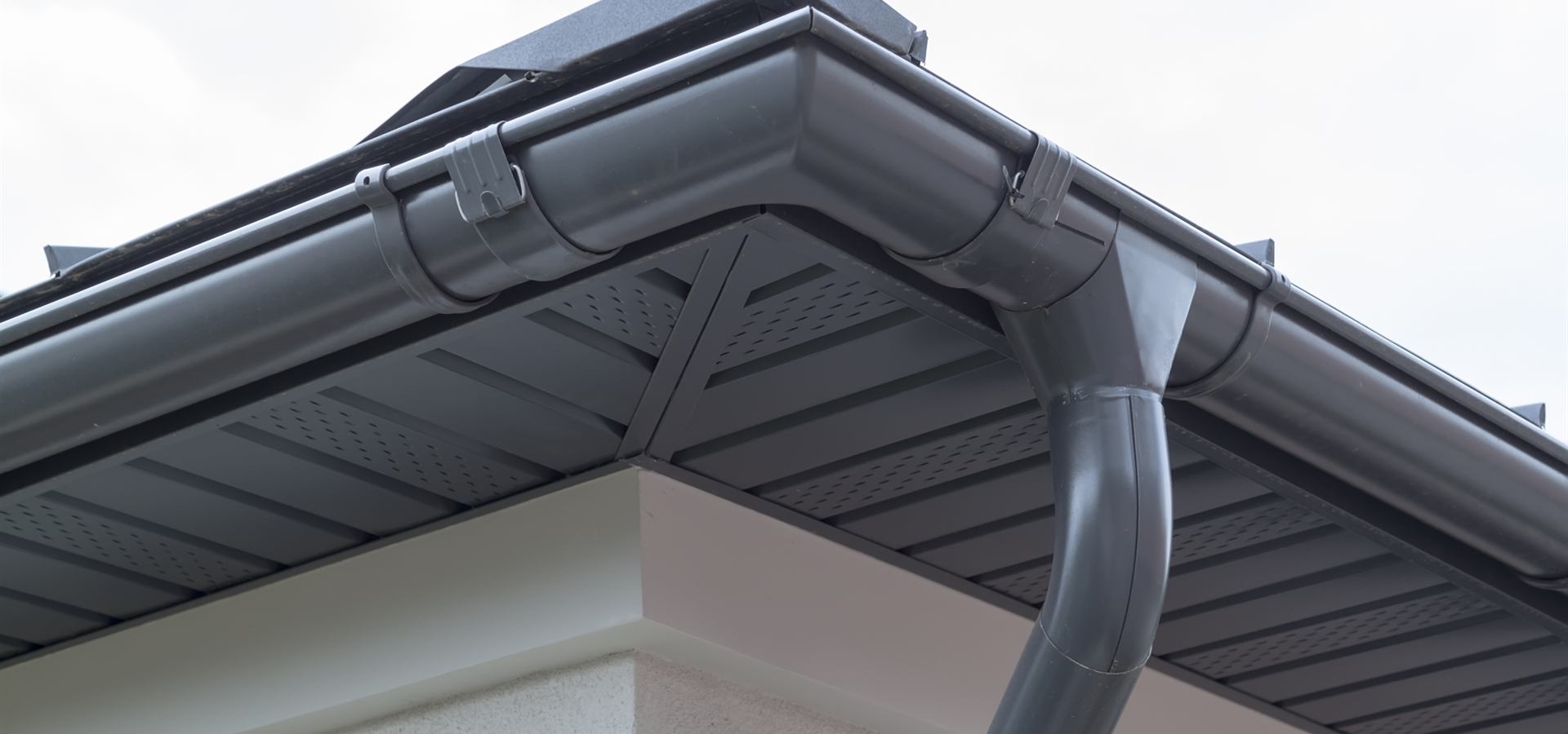 New grey guttering and fascia on a modern house